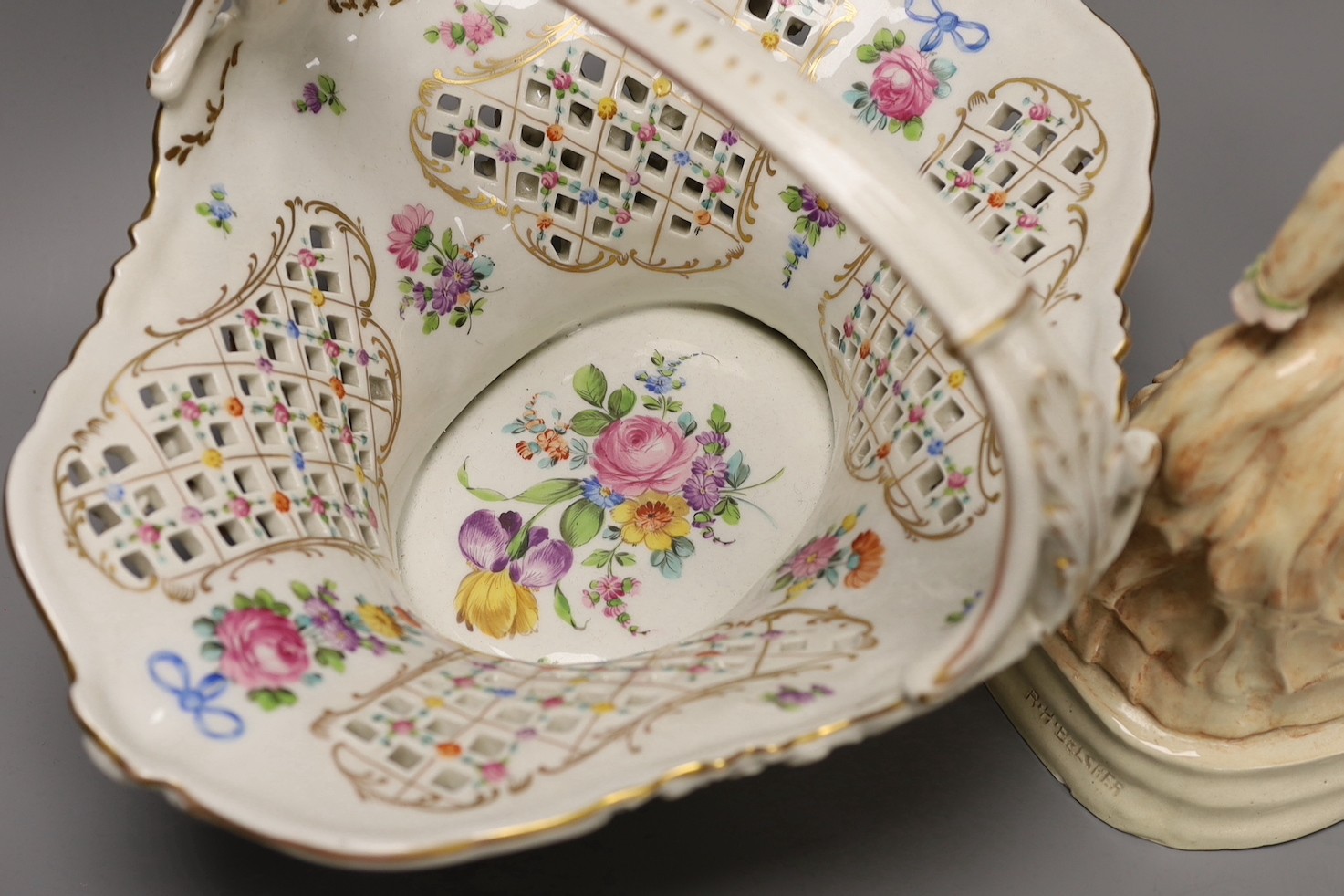 R. H. Belcher, pottery figure of a lady, 24cm and a Dresden porcelain floral encrusted basket 34cm